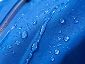 blue waterproof fabric with water dripping off
