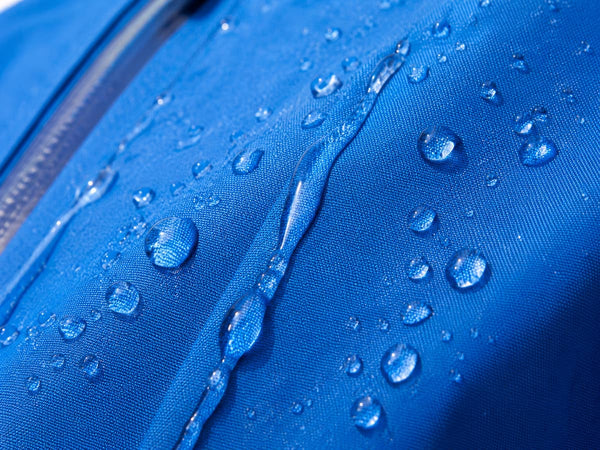 blue waterproof fabric with water dripping off