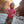Child in a pink hoodie standing in a rocky canyon